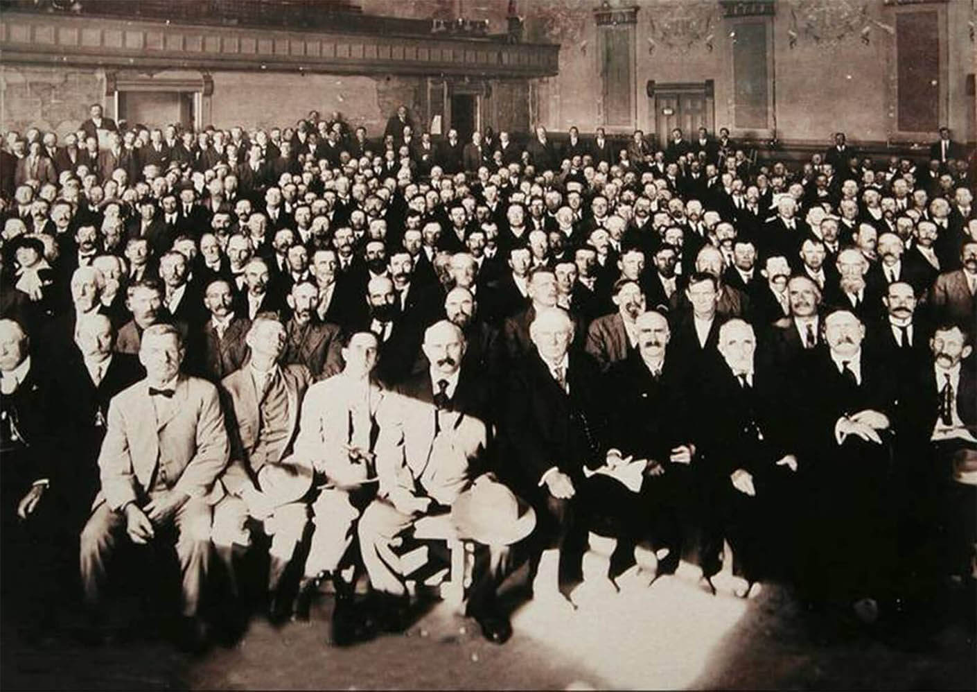 A black and white photo of an entrepreneurial group of raisin growers, who later became known as The California Associated Raisin Company.